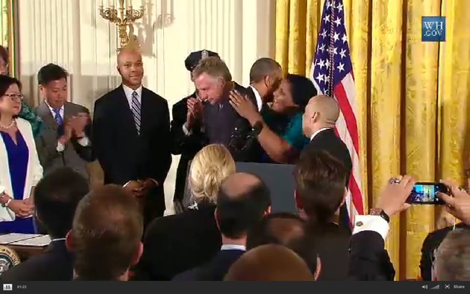 Signing of Executive Order barring workplace discrimination for LGBT people, President Obama hugging BiNet USA's Faith Cheltenham